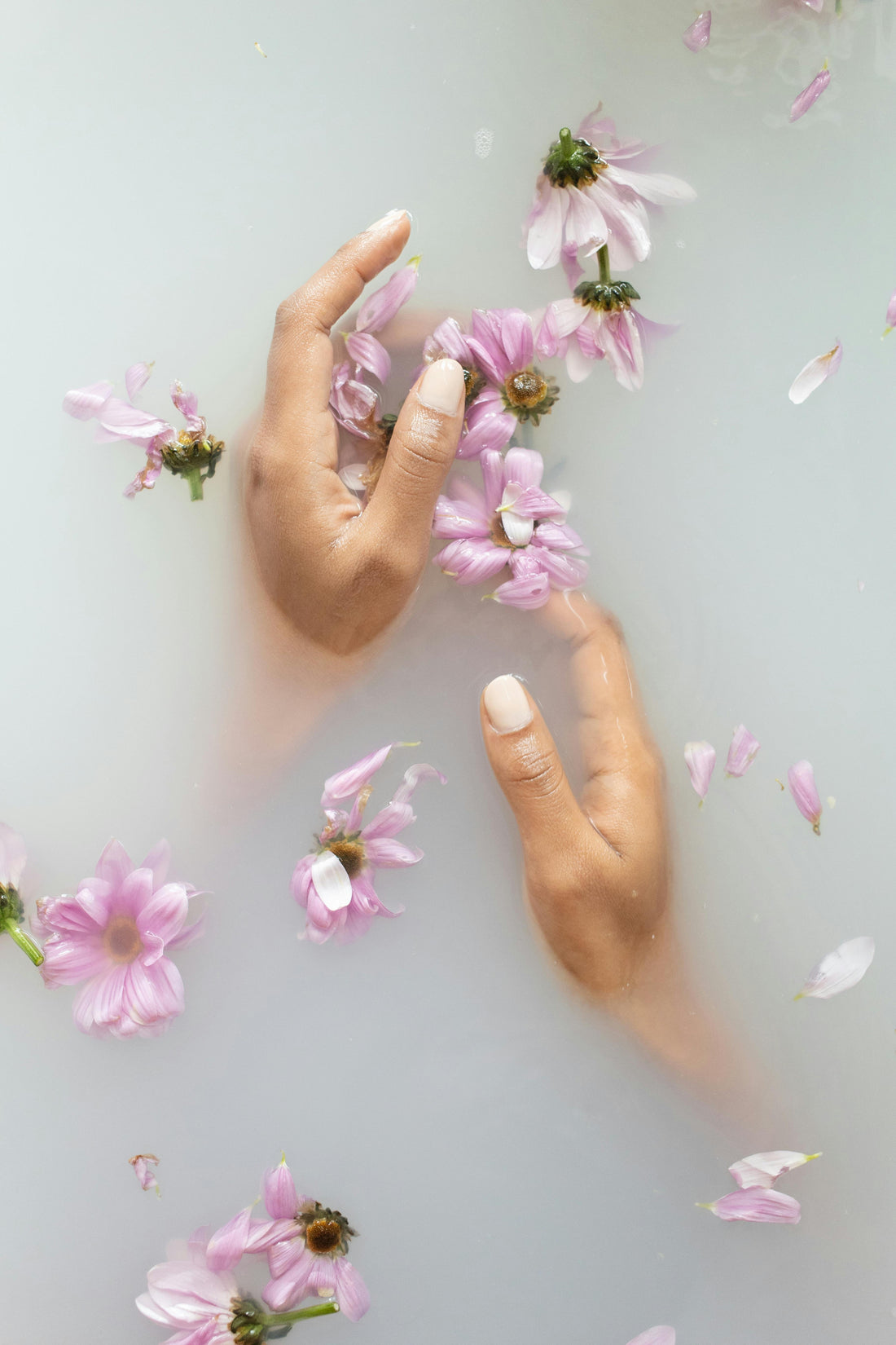 Two hands in floral water