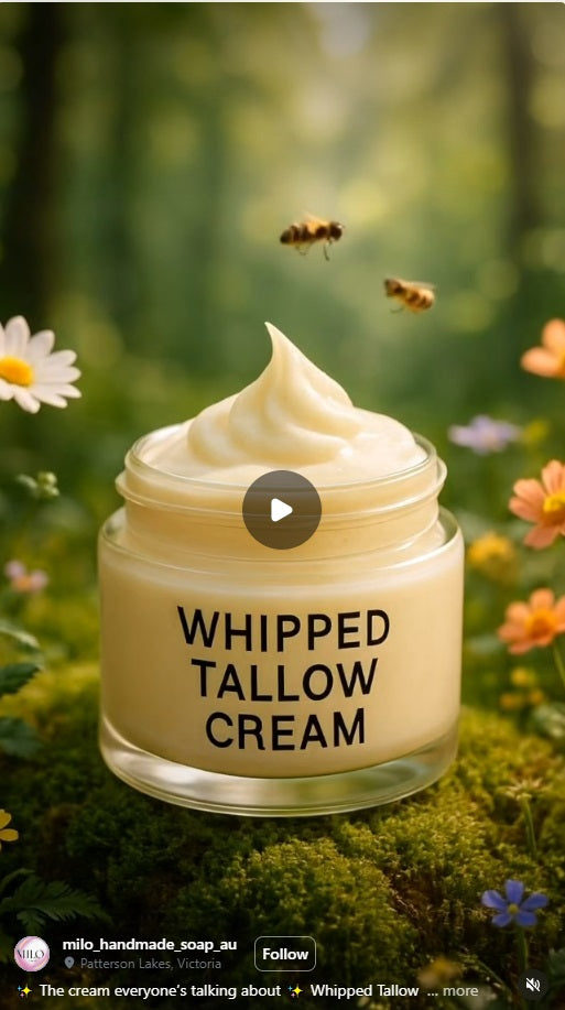 Jar of whipped tallow cream with bees and flowers in the background